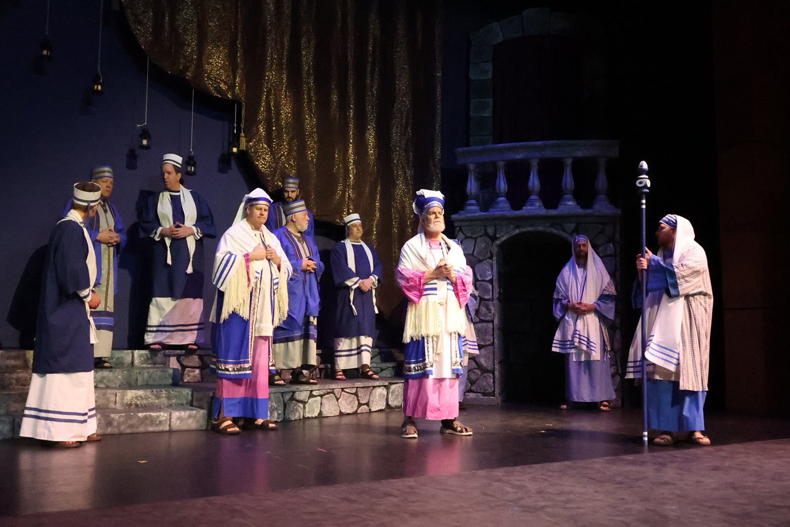 Men in clerical attire from biblical times gather in discussion.